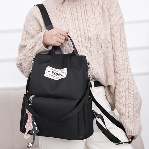 กระเป๋าสะพายหลังป้องกันการโจรกรรมมัลติฟังก์ชั่น Crossbody Casual Tote Bag พร้อมจี้ประดับ, 624