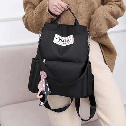 กระเป๋าสะพายหลังป้องกันการโจรกรรมมัลติฟังก์ชั่น Crossbody Casual Tote Bag พร้อมจี้ประดับ, 624