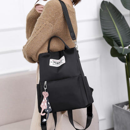 กระเป๋าสะพายหลังป้องกันการโจรกรรมมัลติฟังก์ชั่น Crossbody Casual Tote Bag พร้อมจี้ประดับ, 624
